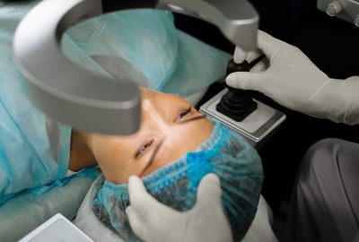 Pleasant young woman having her eyesight checked while having a medical checkup